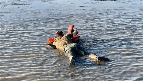 Wildlife officials use rafts made of life jackets to rescue stranded ...