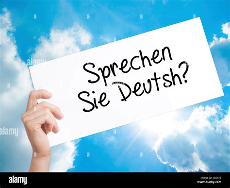Do You Speak German? (in German) Sign on white paper. Man Hand Holding ...