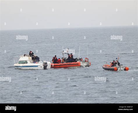 The crews of the Coast Guard Cutter Haddock and Cutter Forest Rednour ...