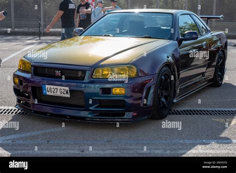 Front view of a tenth generation Nissan Skyline GT-R34 with a changing ...