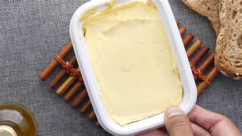 Tub of butter or margarine on placemat on table 15808102 Stock Video at ...