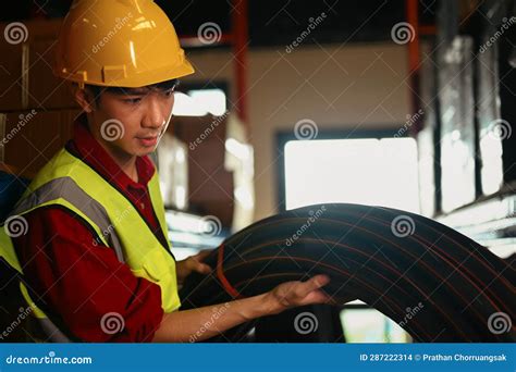 Asian Male Worker in Hardhats and Vests Working in Retail Warehouse. Logistics, and Manufacture ...