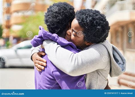 African American Man and Woman Couple Smiling Confident Hugging Each ...