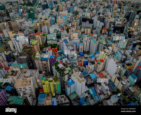 Aerial top down cityscape abot Malé, Capital of Maldives in Indian ocean. Colorful houses ...