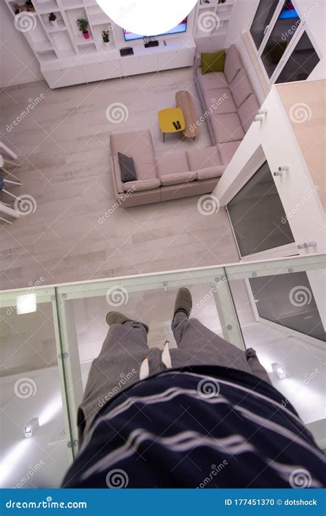 Man Standing Upstairs on Glass Floor Stock Photo - Image of bright ...
