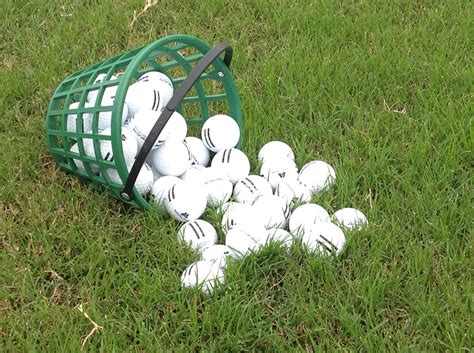 Bucket of Golf Balls on Green Grass