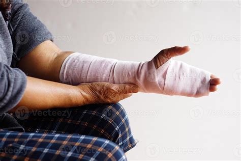 Closeup hand wrapped with bandage on sprain wrist, injury arm treatment. Concept, health problem ...