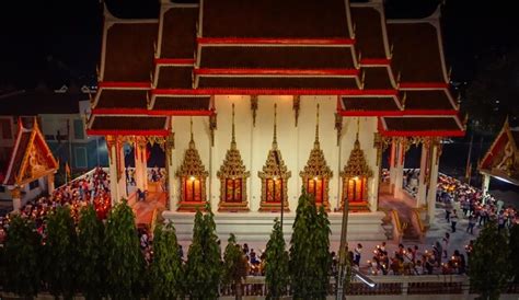 Temple at night illuminated with light from decorations
