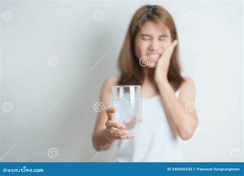 Teeth Sensitive To Cold Concept. Woman Hold Ice Cream And Having ...