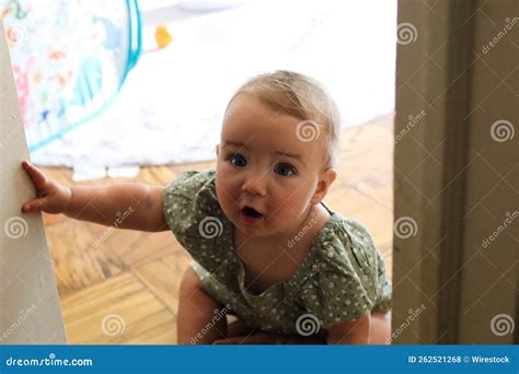 10 Month Old Caucasian Baby Girl Crawling Towards a Room Door Stock ...