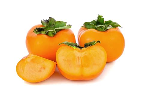 Fresh ripe persimmons isolated on white space | Premium Photo