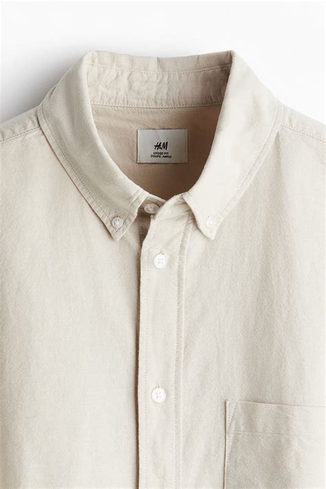 Loose Fit Short-sleeved Oxford shirt - Light beige - Men | H&M IN