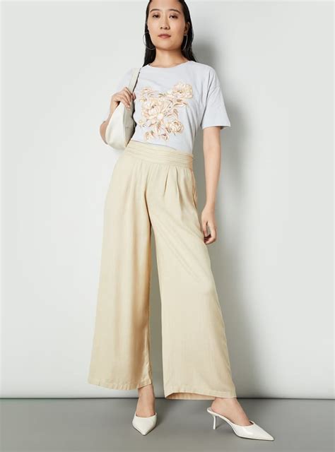 Buy Women Solid Wide Leg Trousers Online at just Rs. 1199.0 ...