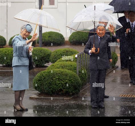 Japan's Emperor Akihito and Empress Michiko are welcomed at Odaka lifelong learning centers in ...