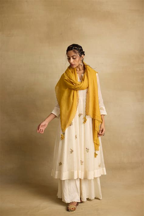 Asin - An ivroy white mul chanderi anarkali with sharara paired with a