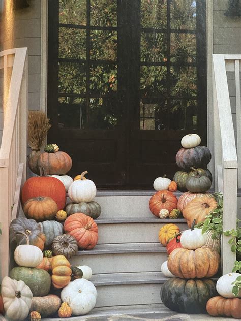 Autumnal Porch Decor with Pumpkins and Gourds