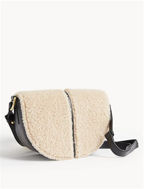 Buy Faux Shearling Saddle Cross Body Bag at Marks & Spencer