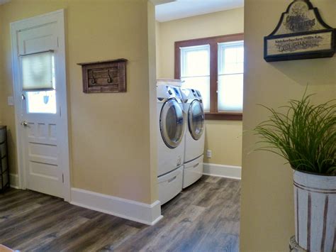 Open Laundry Room with Rustic Vinyl Plank Flooring