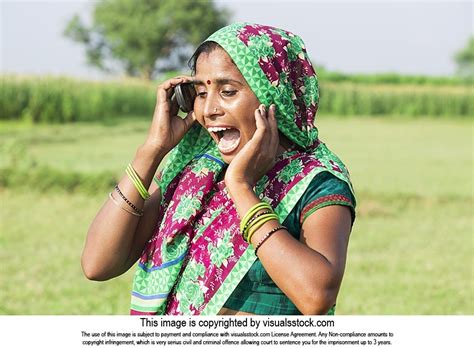 Shouted Indian Rural Villager Woman Talking Mobile Phone In Field