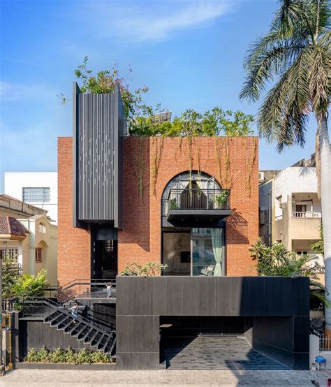 Inside a Surat home defined by the warmth of brick and natural light ...