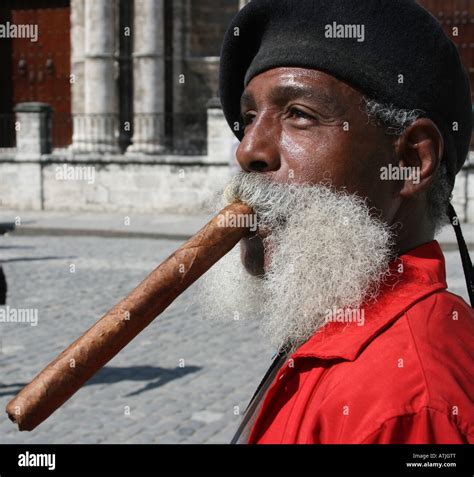 Cuban Man smoking very large cigar Stock Photo - Alamy