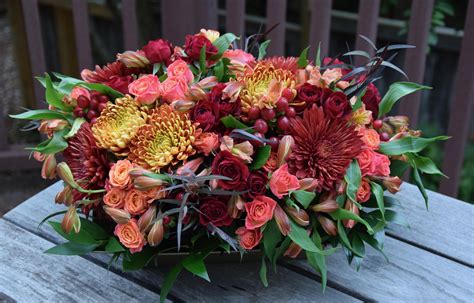 Thanksgiving table centerpiece with mums, spray roses, hypericum ...