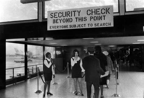 This concourse at O'Hare is said to be "sterilized." Beyond this checkpoint lie the boarding ...