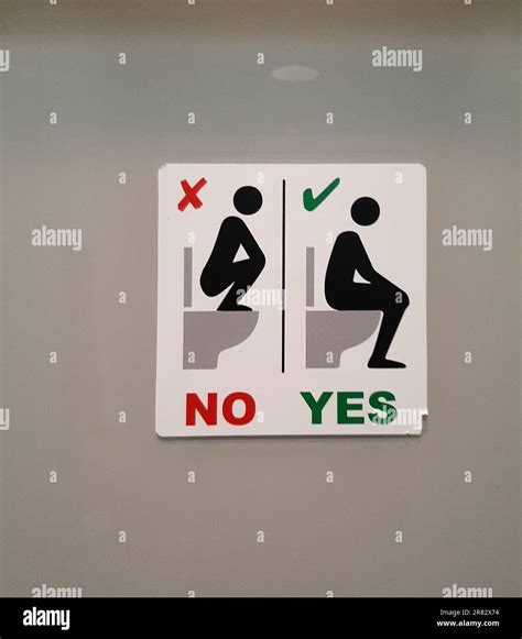 Funny Washroom Sign - do not squat on top of toilet seat Stock Photo ...