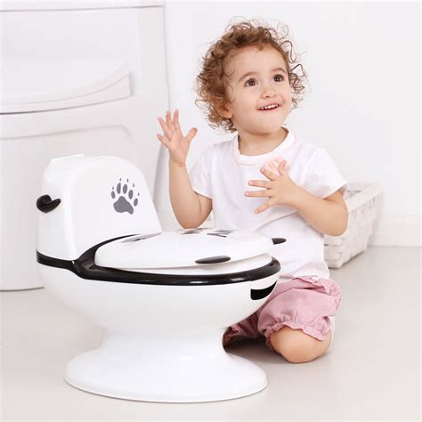 baby sitting on knees and smiling