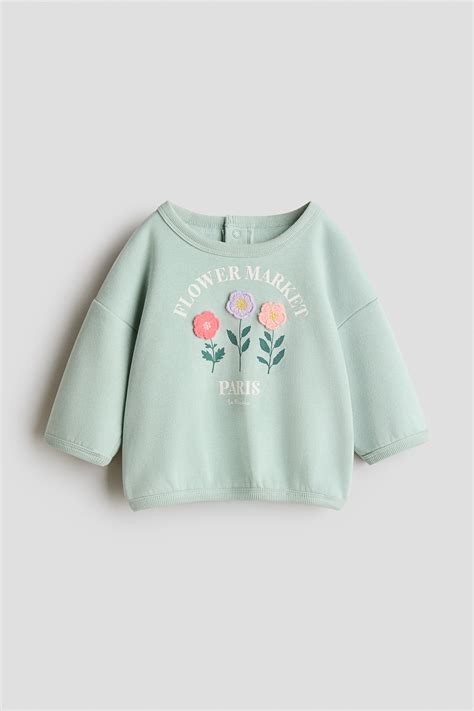 Motif-detail sweatshirt - Light dusty green/Flowers - Kids | H&M IN