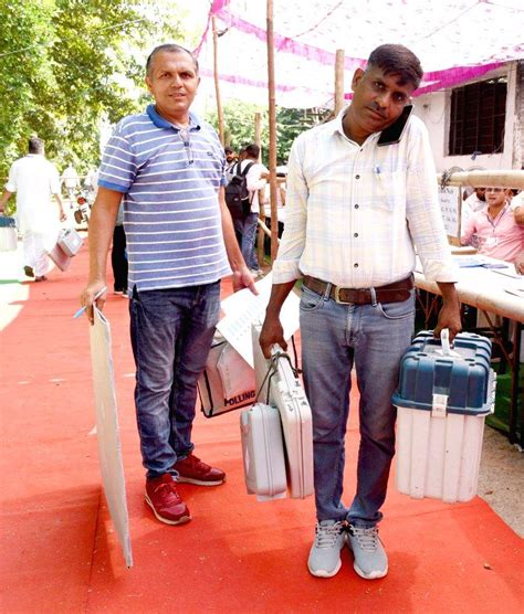Polling officials are checking the Electronic Voting Machine (EVMs)