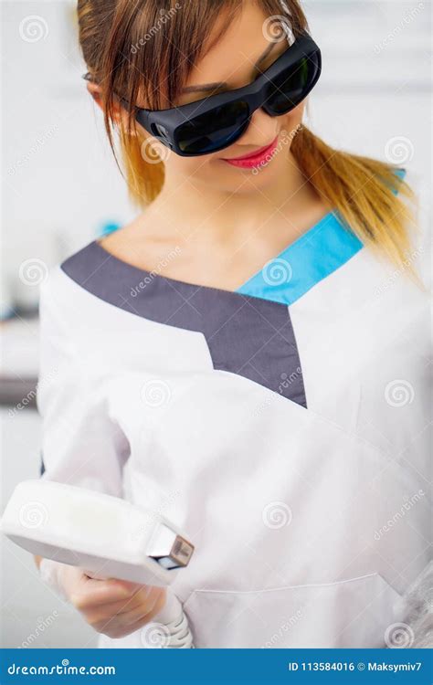Face Care. Facial Laser Hair Removal. Beautician Giving Laser Epilation Treatment To Young Woman ...