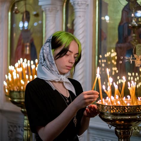 The girl looks a Billie Eilish is holding a candle | Православная икона ...