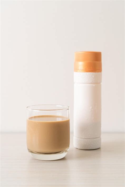 Coffee latte glass with ready to drink coffee bottles | Premium Photo