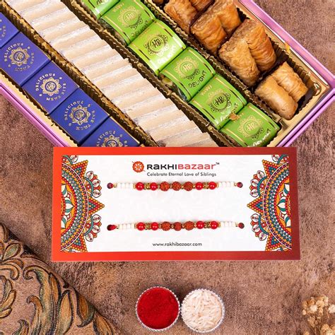Send Rudraksha Rakhi with Haldiram Sweet Box Online | Rakhibazaar.com