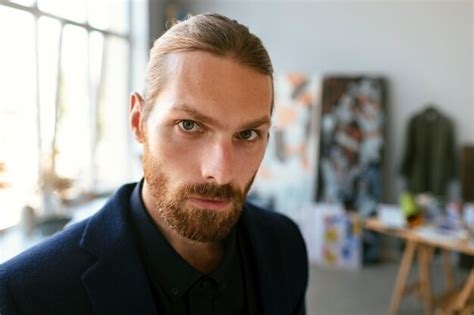 Portrait of bearded man in an art studio | Free Photo