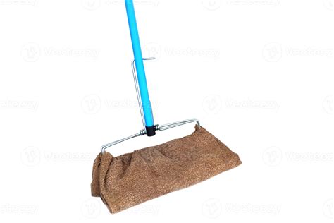 A homemade mop made from a recycled towel and a blue metal handle on ...