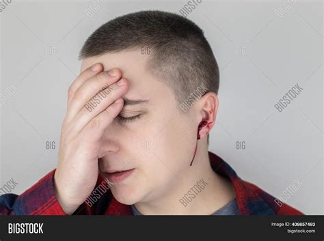 Man Whose Ear Bleeding Image & Photo (Free Trial) | Bigstock