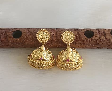 DREAMJWELL - Gold tone big Lakshmi coin ruby jhumkka dj-34545 – dreamjwell