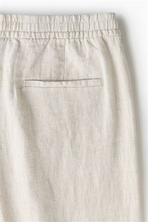 Men’s Light beige Loose Fit Linen trousers | H&M IN
