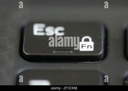 Escape and function lock key on a laptop keyboard Stock Photo - Alamy