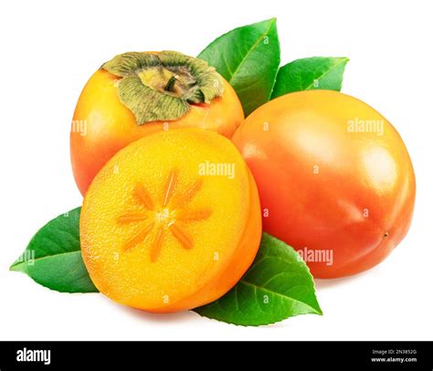 Ripe orange persimmon fruits or kaki fruits with leaves and cross cut ...