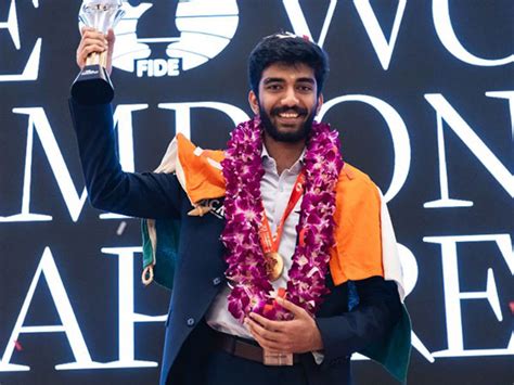 D Gukesh receives FIDE World C'ship trophy, hands it over to parents in ...