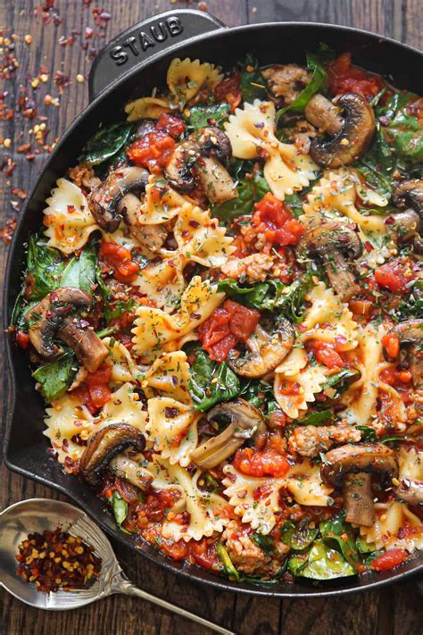 Italian sausage pasta with spinach, mushrooms, and tomato sauce ...