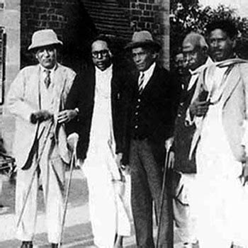 Signs the Poona Pact with Ambedkar