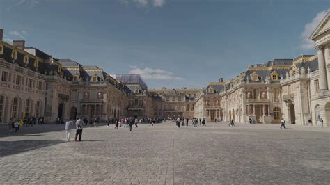 Versailles, France - March 19, 2024 - Tourists crowd the Royal Court at ...