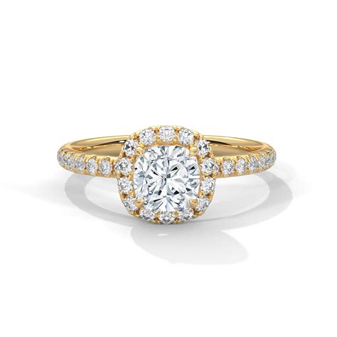 A cushion-cut lab-grown diamond surrounded by a delicate halo — timele ...