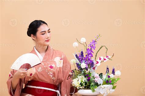 Young 20s Asian Japanese woman wear traditional Kimono, does Ikebana ...