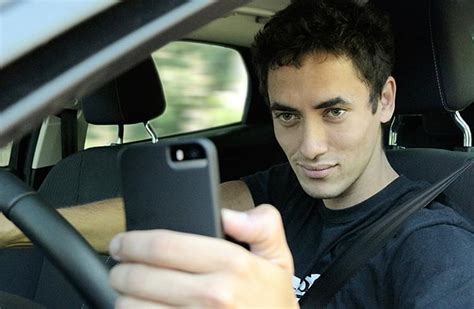 UK motorists urge stiffer penalties for drivers caught using phones ...