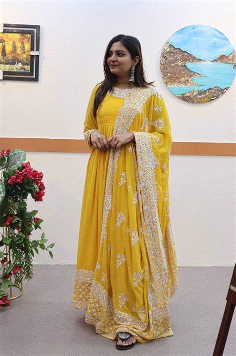 Yellow Fox Georgette Sequin Embroidered Gown with Flowing Sk